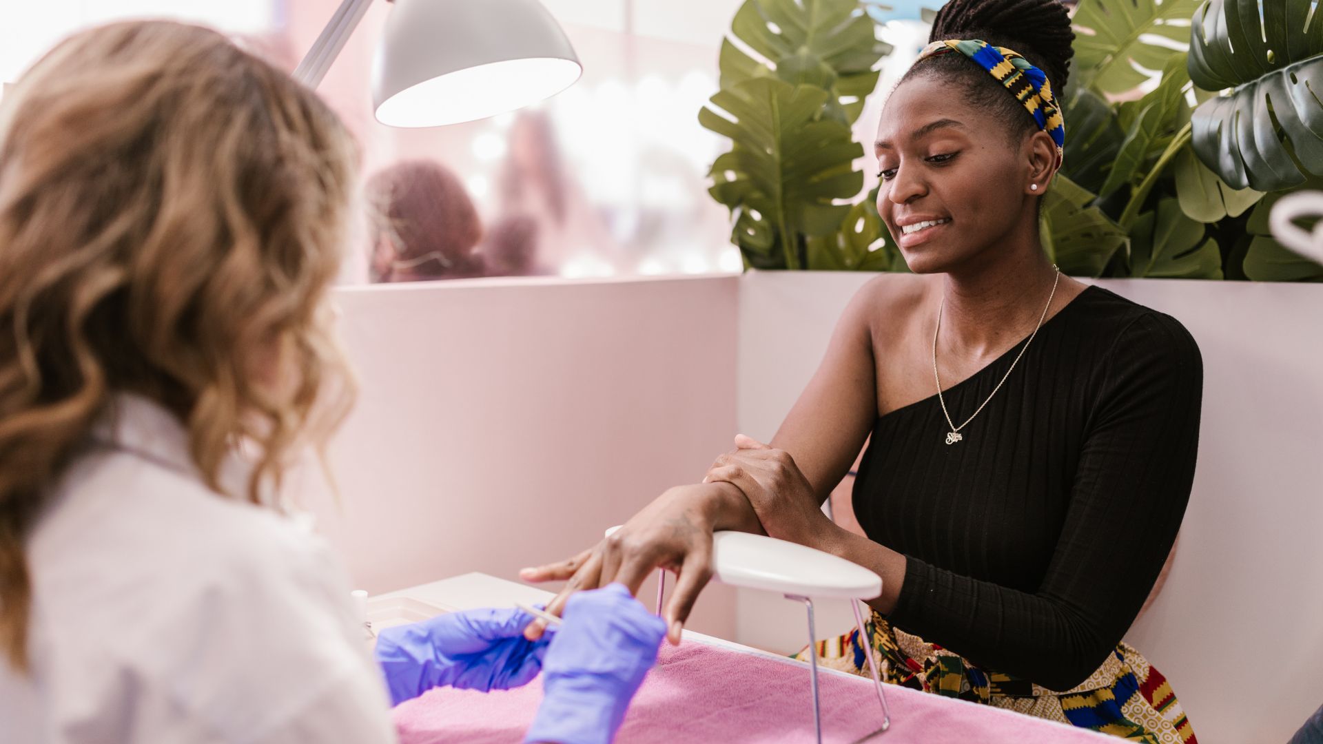 Client and nail technician at the manicure station