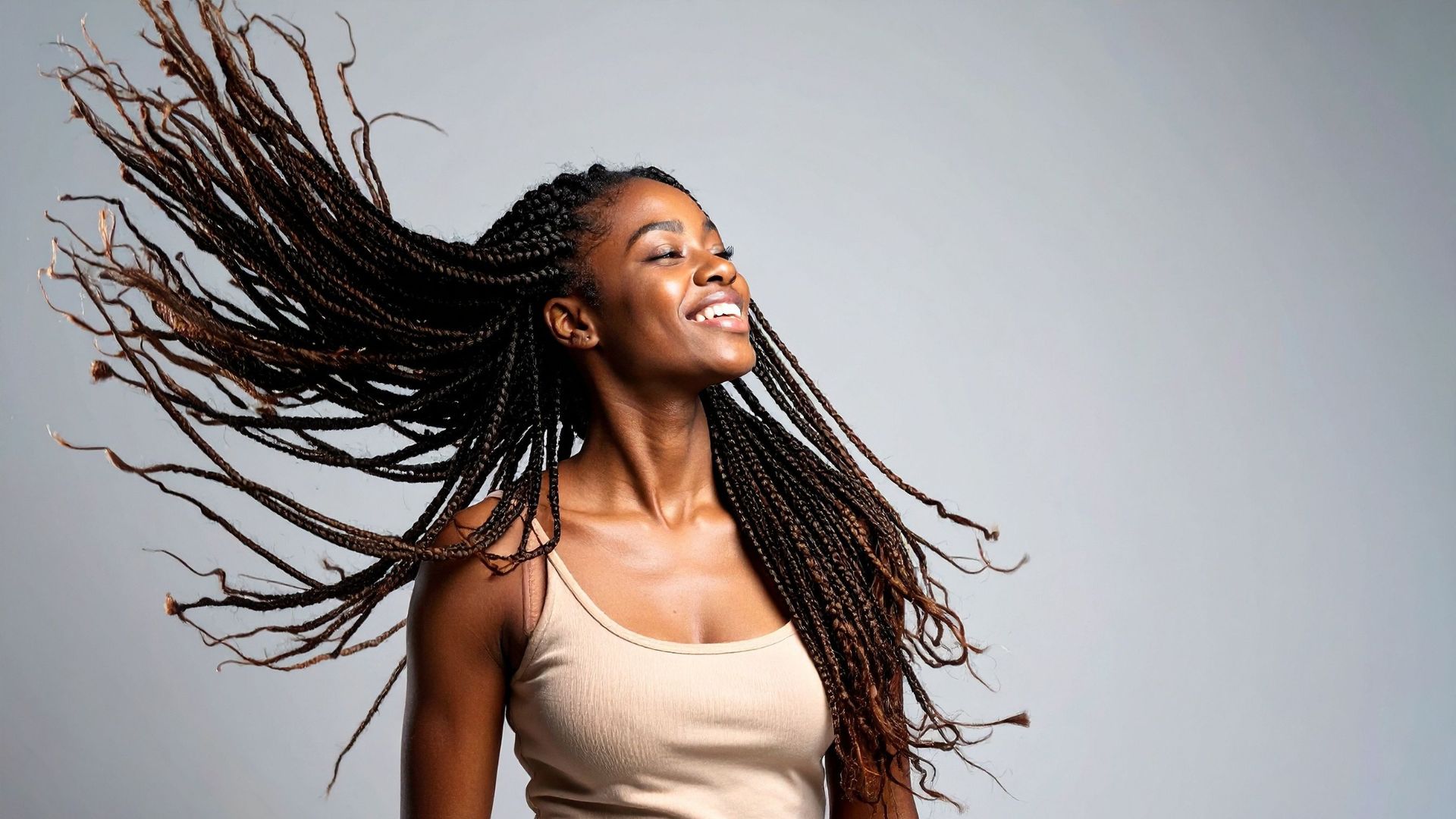 Editorial frame of braids swinging through the air