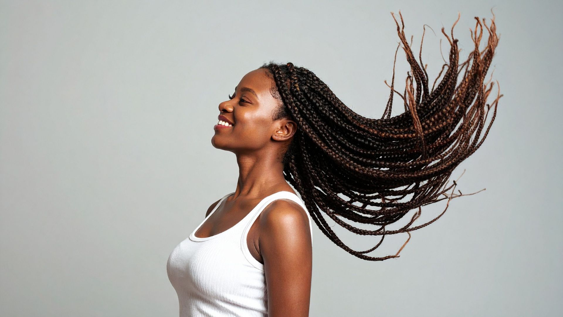 Braided style captured mid-motion in a portrait