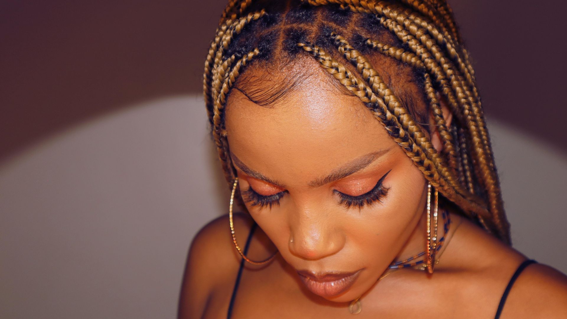 Portrait of a completed knotless braid style