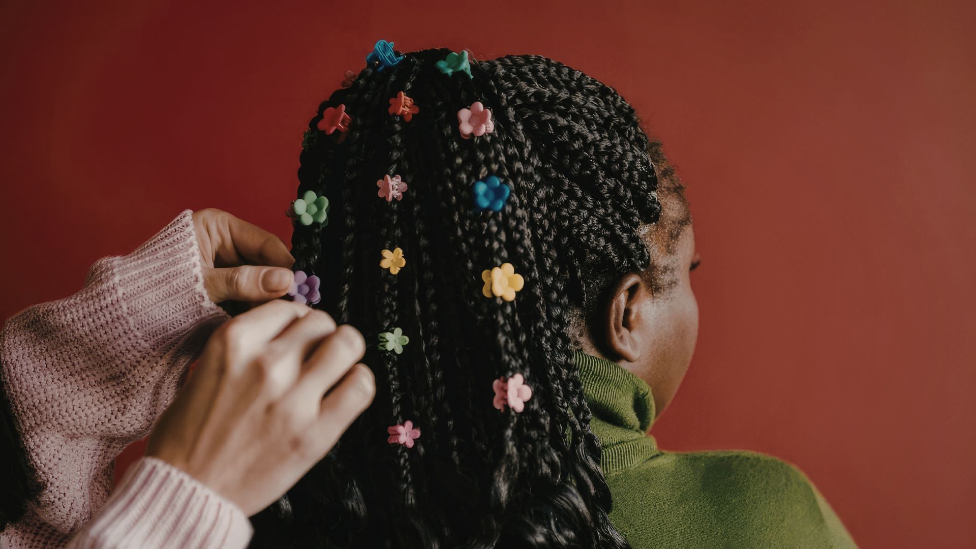 Finishing detail with accessories worked into braided hair