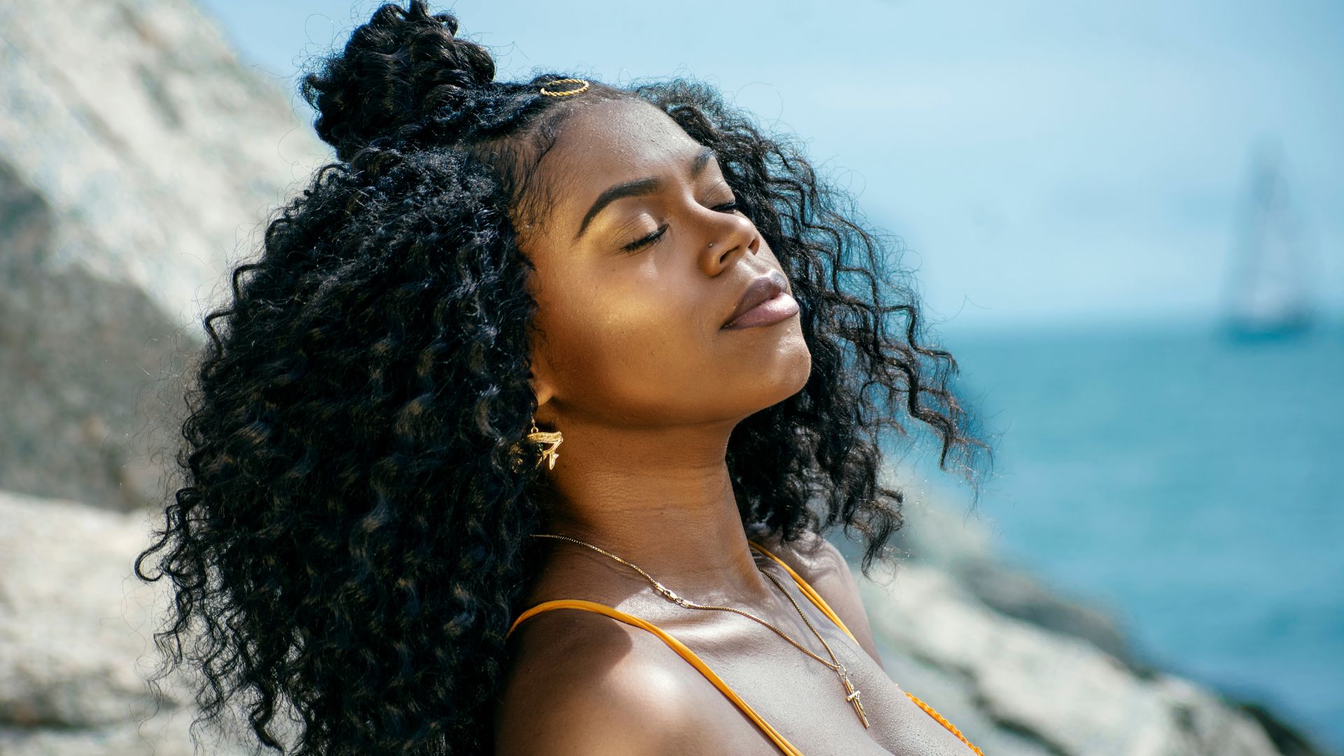 Outdoor editorial portrait of defined curls