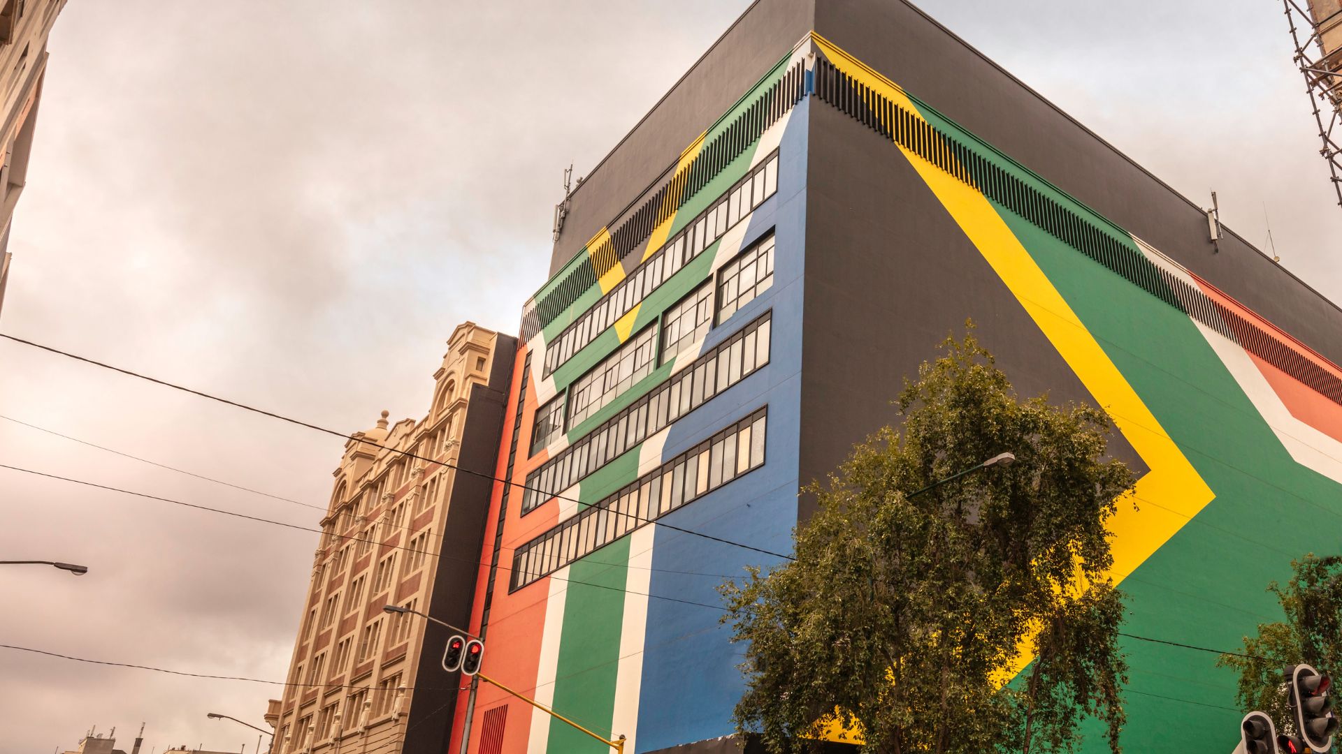 Building facade painted with the South African flag