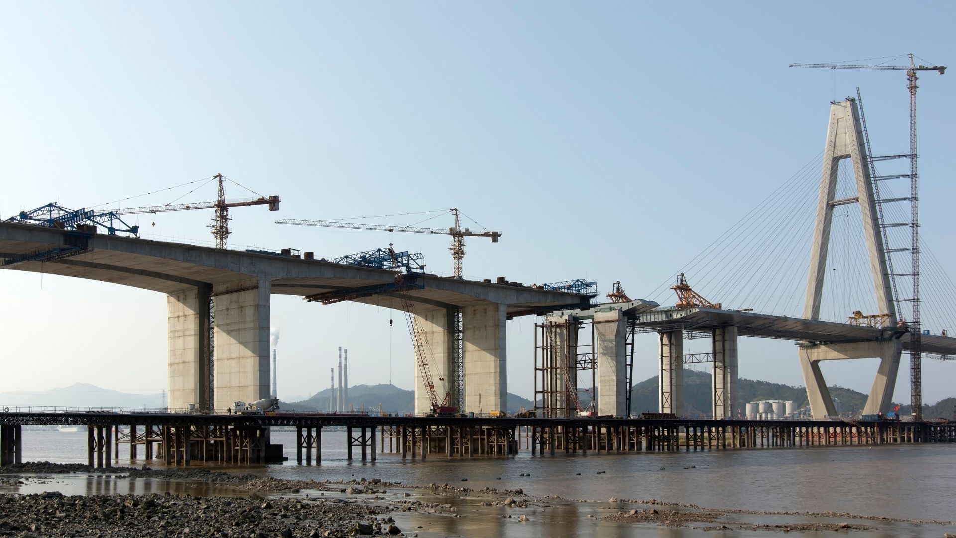 Bridge deck under construction over a river crossing