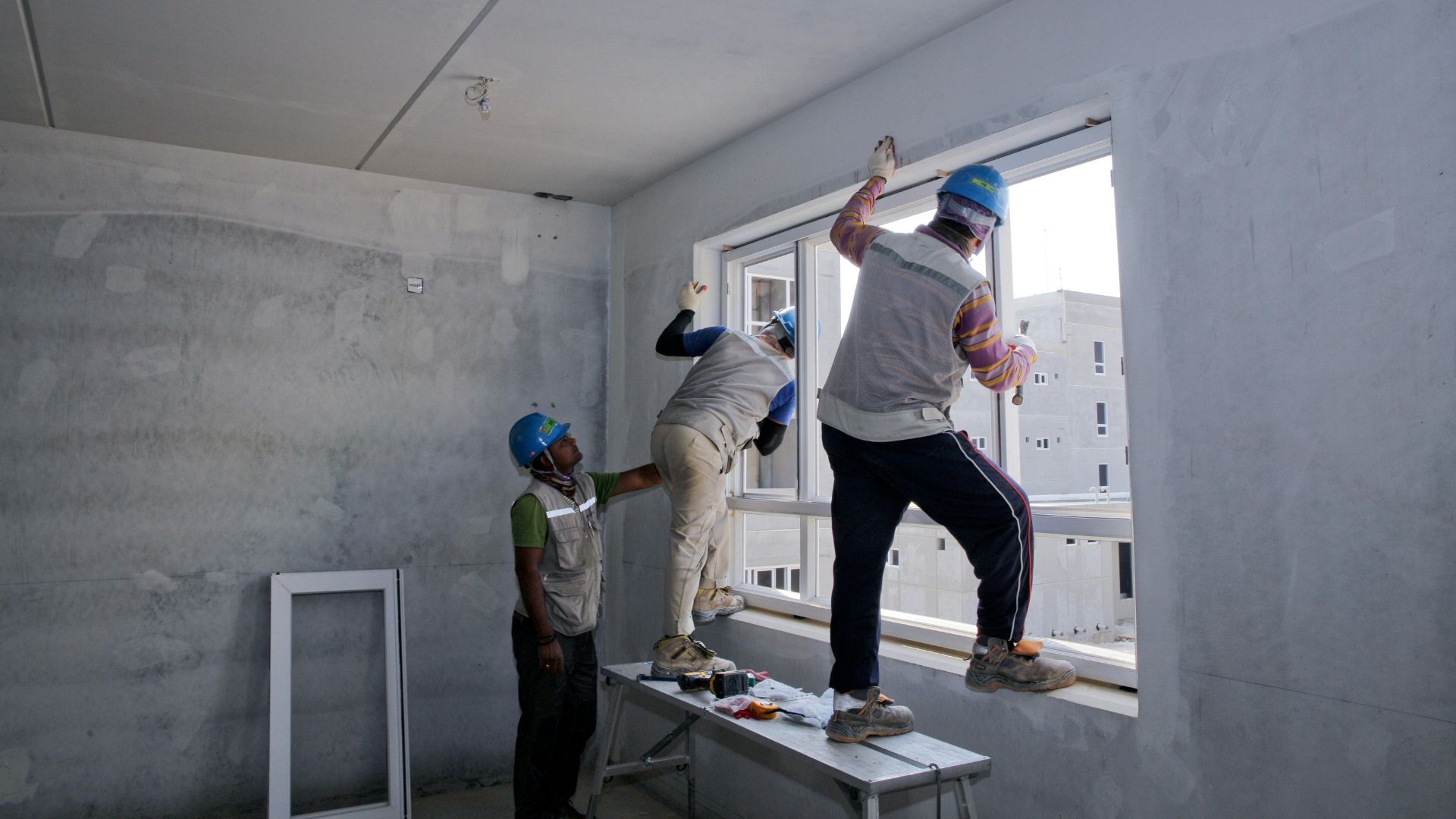 Interior window and finishing work in progress on a building
